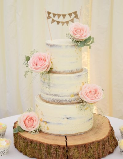 luxury wedding cake dressed with fresh blooms