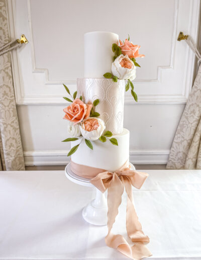 Luxury wedding cake Cornwall - Dollybird Bakes - Three tier elegant cake - royal icing stencil / lustre - handcrafted sugar blooms at Tregenna Castle