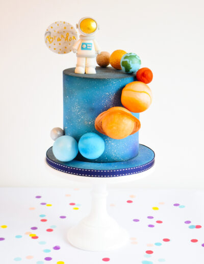 Celebration Cake - Space Themed cake - Featuring an astronaut, and the solar system.