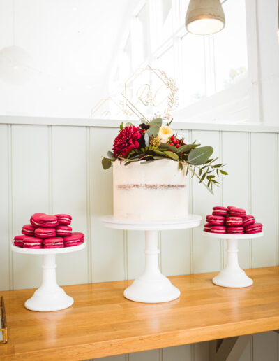 Wedding Cake - Single tier wedding with accompanying macarons - fresh floral accents.