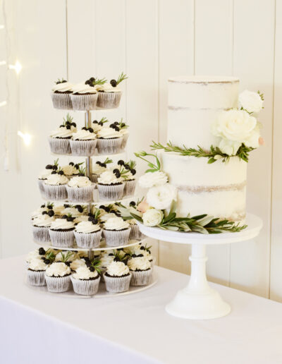 Wedding Cakes In Cornwall - Dollybird Bakes - Wedding cupcake tower at Launcells Barton - Luxury cupcakes with fruit & herb accents